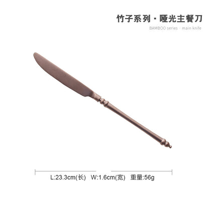 A stainless steel knife and fork set