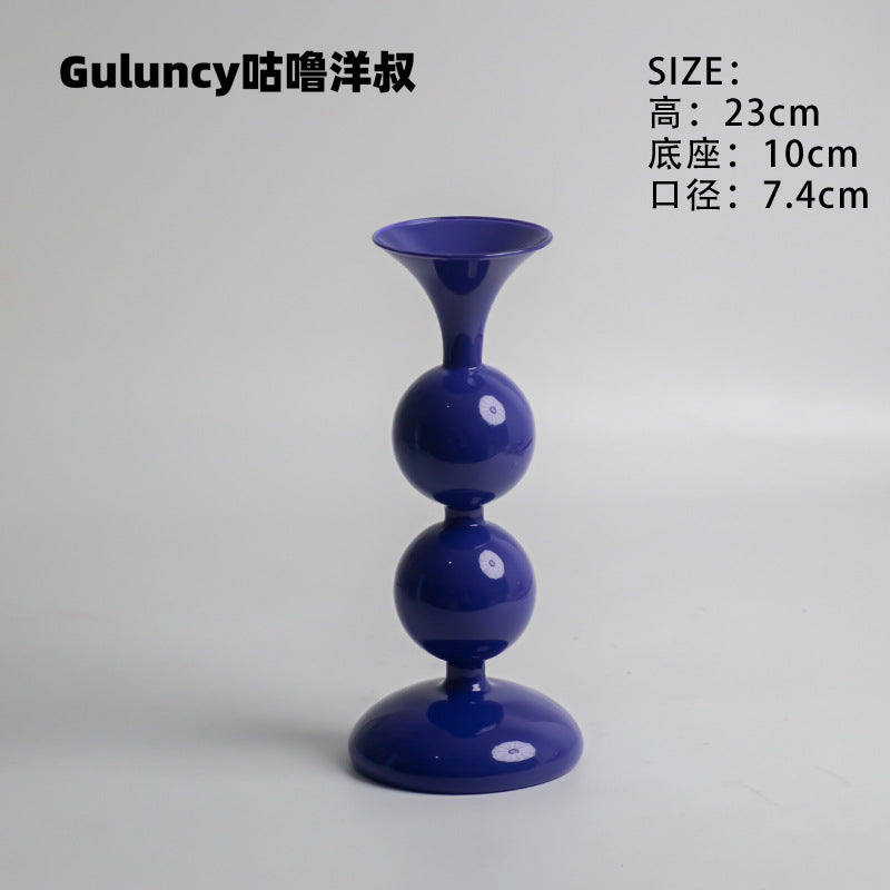 A vintage French Roman column glass candle holder