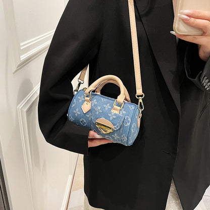 A denim bag cylinder bag