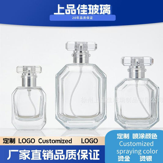 A spray bottle glass perfume bottle
