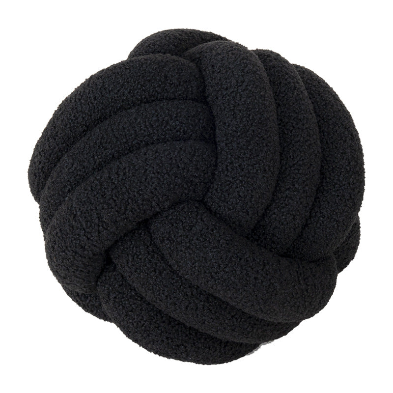 A braided knotted ball pillow
