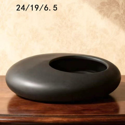 A ceramic flower pot potting container