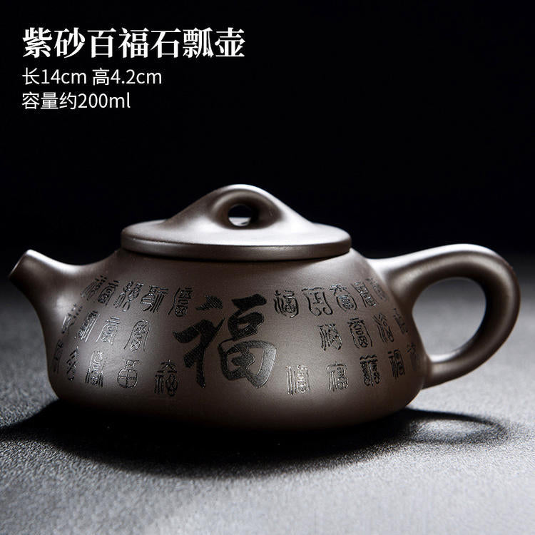 A purple clay pot teapot