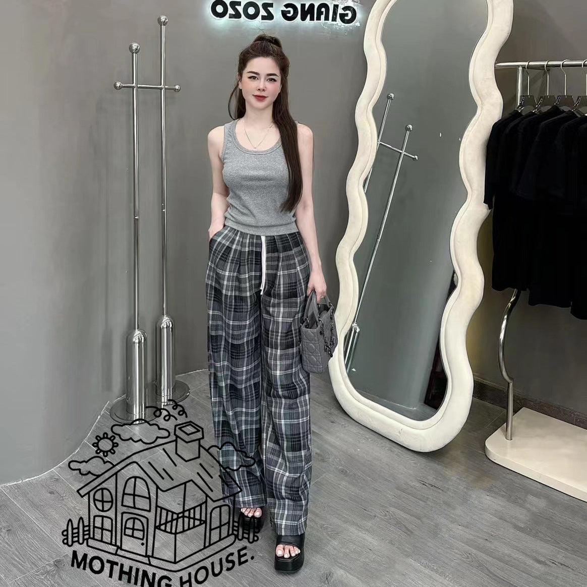 A sports suit women's summer new solid color sleeveless vest top with plaid wide-leg pants casual two-piece trendy