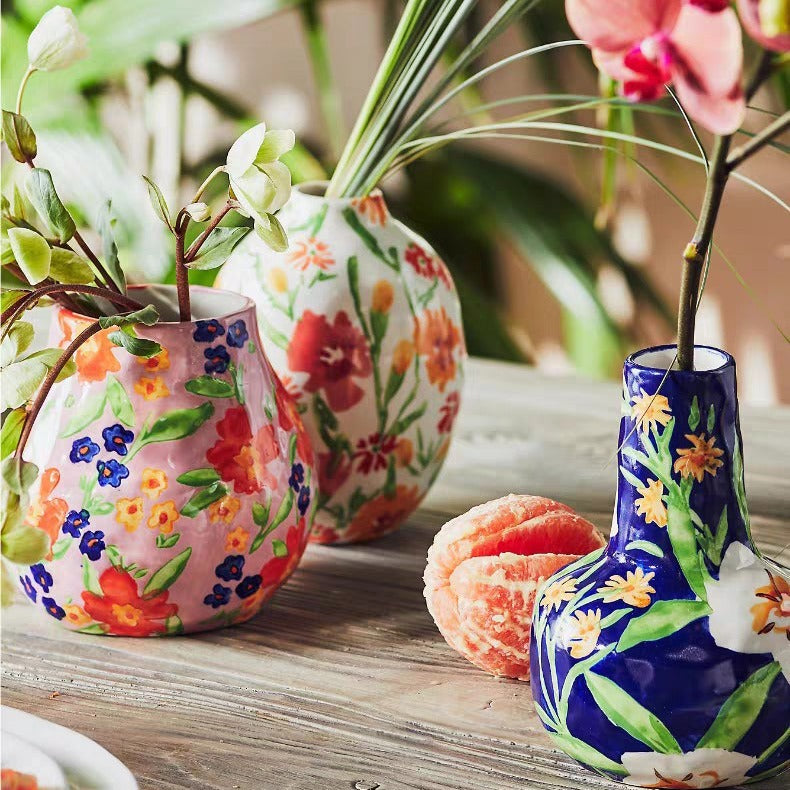 A colorful hand-painted ceramic vase ornament