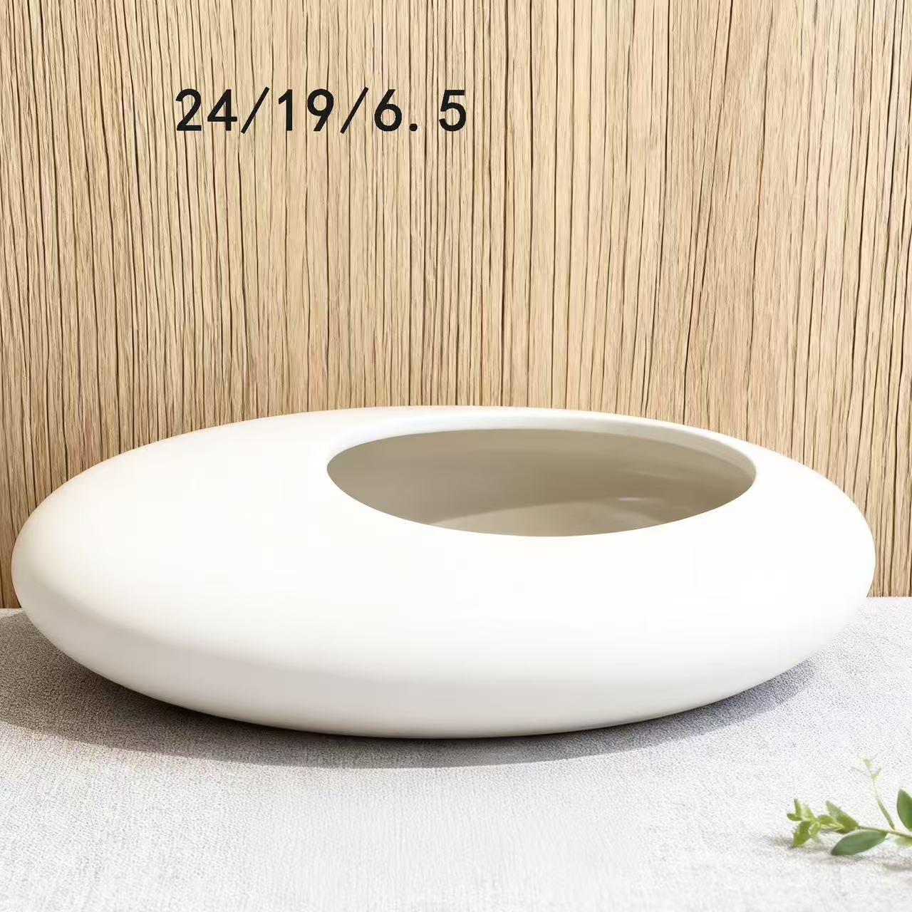 A ceramic flower pot potting container