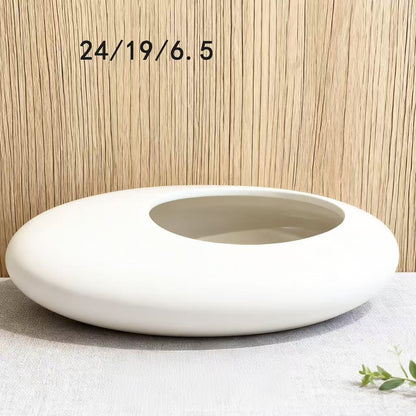 A ceramic flower pot potting container