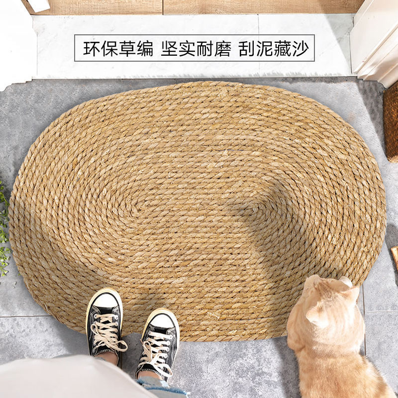 A handmade grass rattan woven carpet floor mat