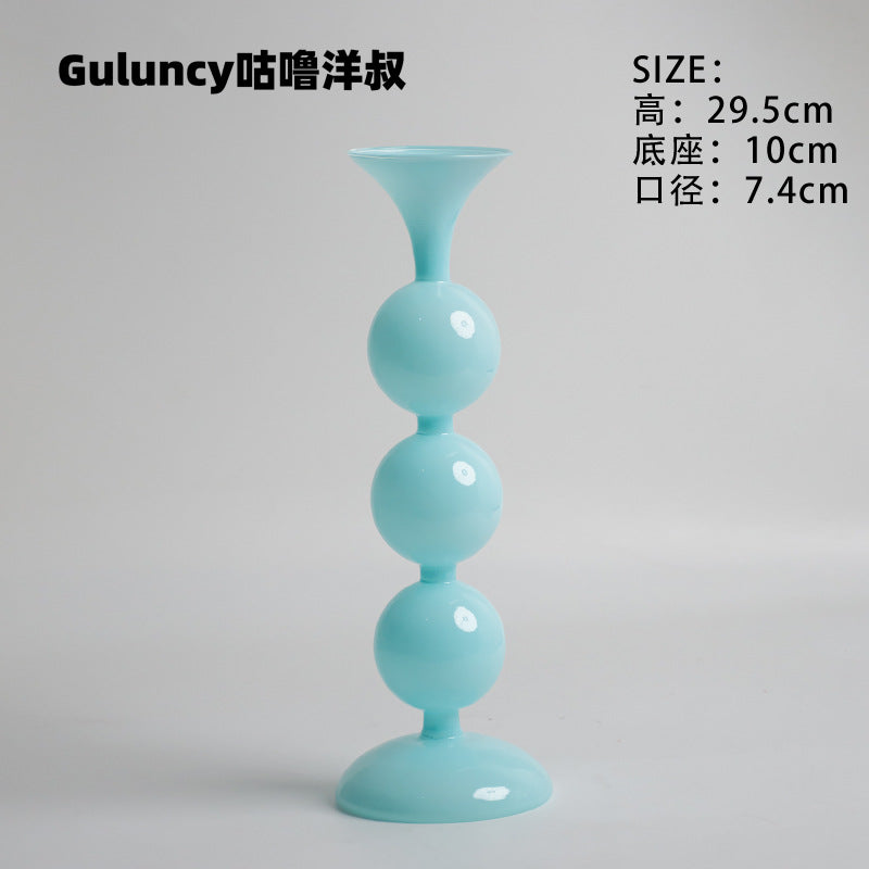 A vintage French Roman column glass candle holder