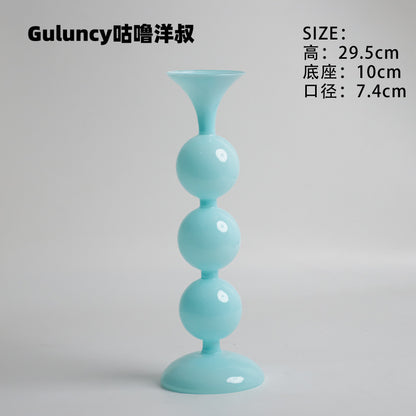 A vintage French Roman column glass candle holder