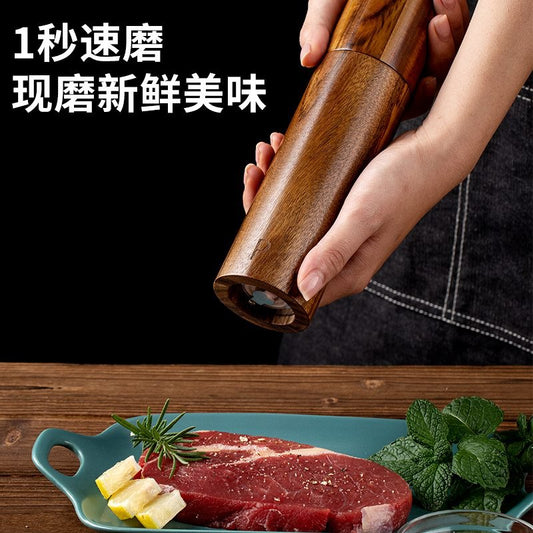 A lobular acacia cylindrical pepper grinder