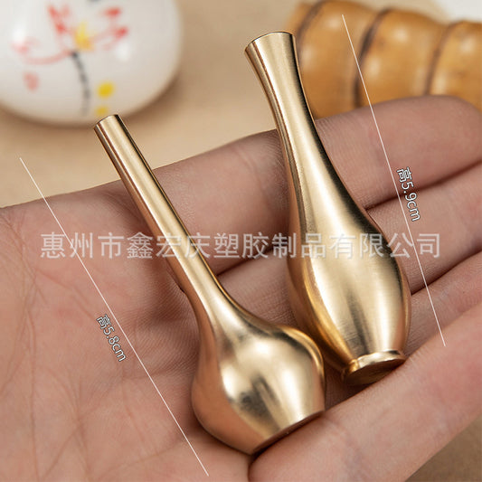 A brass mini vase ornament