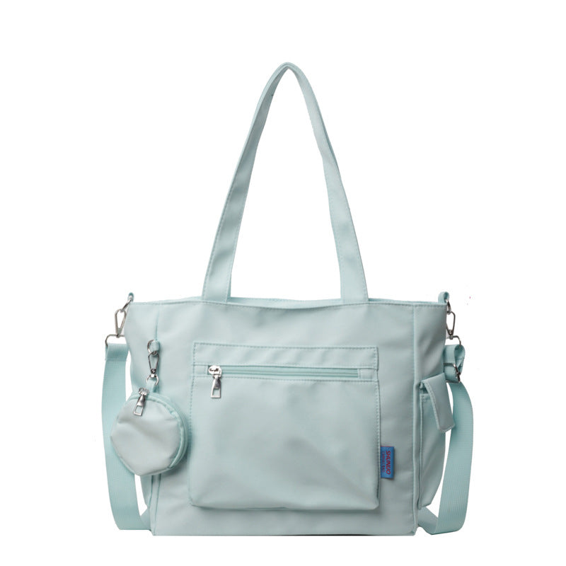 A new solid color canvas bag women's large-capacity shoulder bag student versatile tote bag hand bag messenger cloth bag