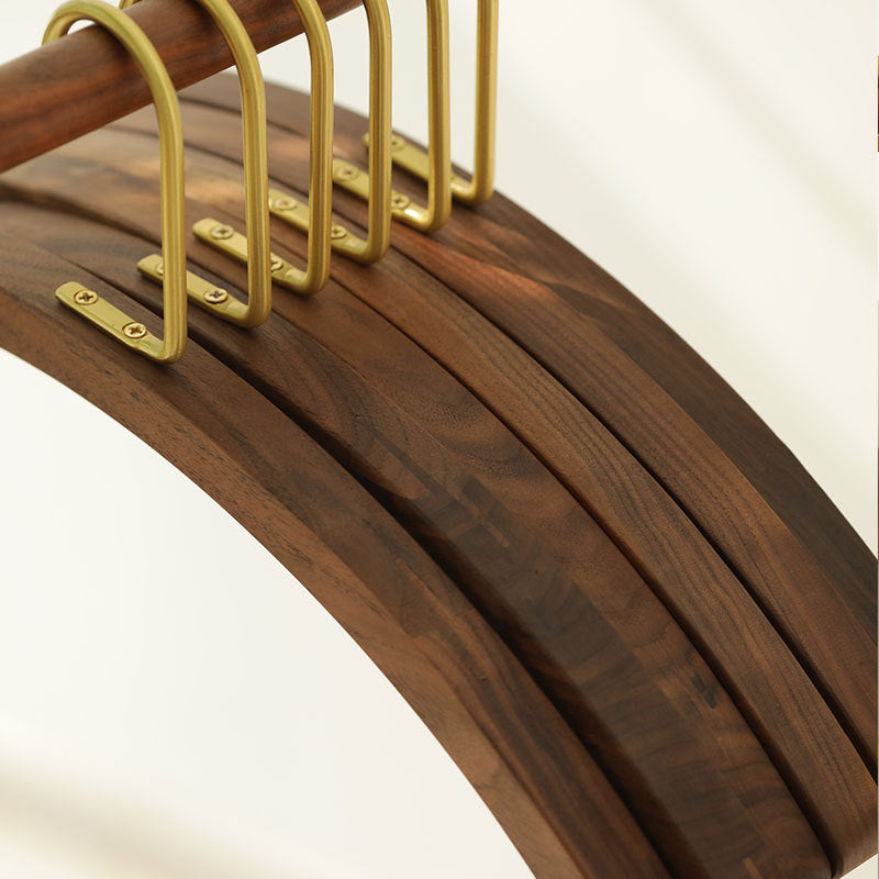 A semi-circular black walnut solid wood hanger