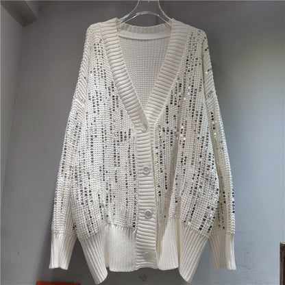A long-sleeved V-neck sequined knit top
