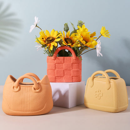 A ceramic handbag vase ornament