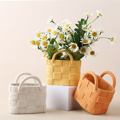 A ceramic handbag vase ornament
