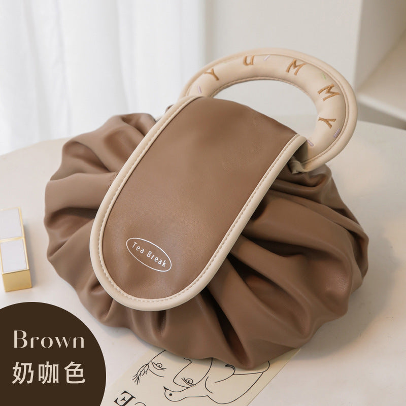 A new lazy drawstring cosmetic bag women's portable waterproof PU travel toilet bag portable storage bag box box