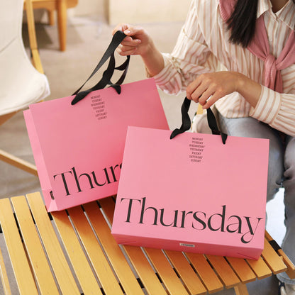 A clothing store tote bag custom paper bag premium sense printing logo high-end ins style high value women's clothing store shopping bag