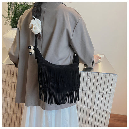 A fringed shoulder bag