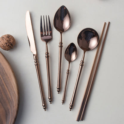 A stainless steel knife and fork set