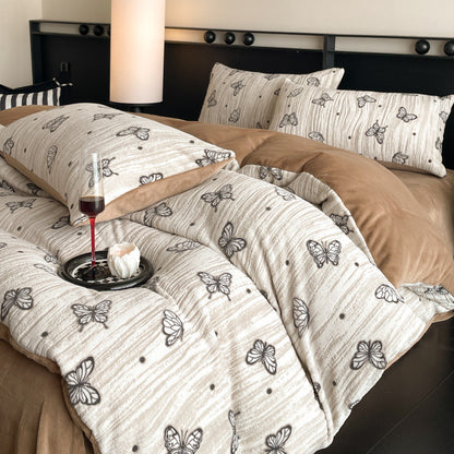 A four-piece quilt cover on the bed