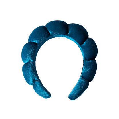 A towel fleece sponge twist headband