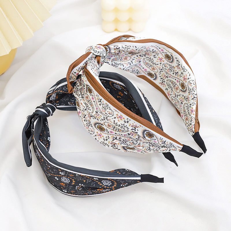 A Korean version of the new product headband fashion calico geometric wide edge headgear hair bundle go out bow hairpin
