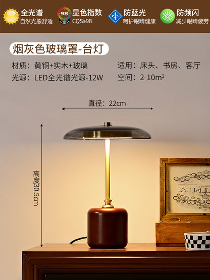 A solid wood glass table lamp