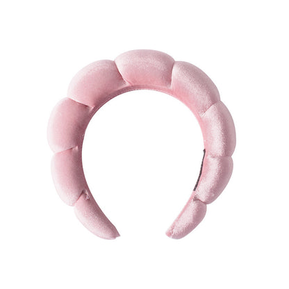 A towel fleece sponge twist headband