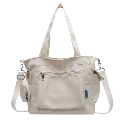 A new solid color canvas bag women's large-capacity shoulder bag student versatile tote bag hand bag messenger cloth bag