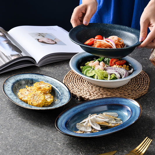 A Japanese creative goose egg-shaped ceramic plate vegetable plate household tableware simple western deep plate pasta plate salad plate
