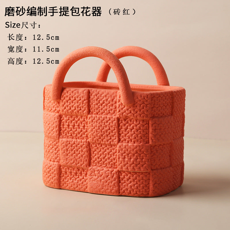 A ceramic handbag vase ornament