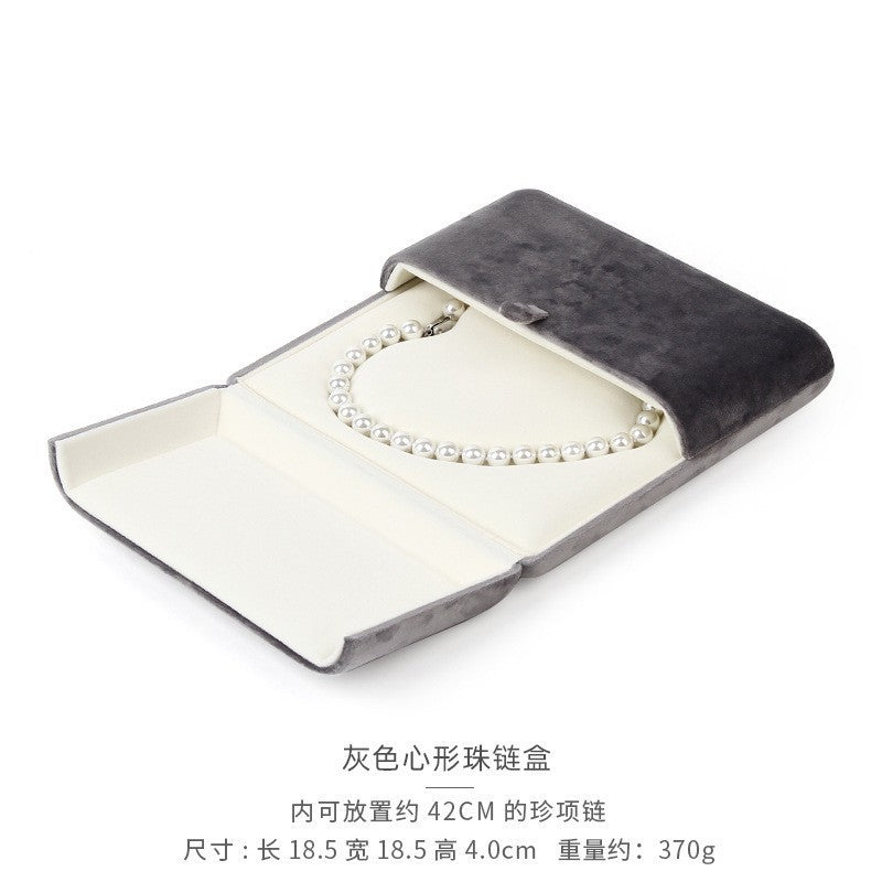 A heart shaped pearl necklace box