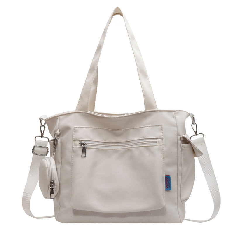 A new solid color canvas bag women's large-capacity shoulder bag student versatile tote bag hand bag messenger cloth bag
