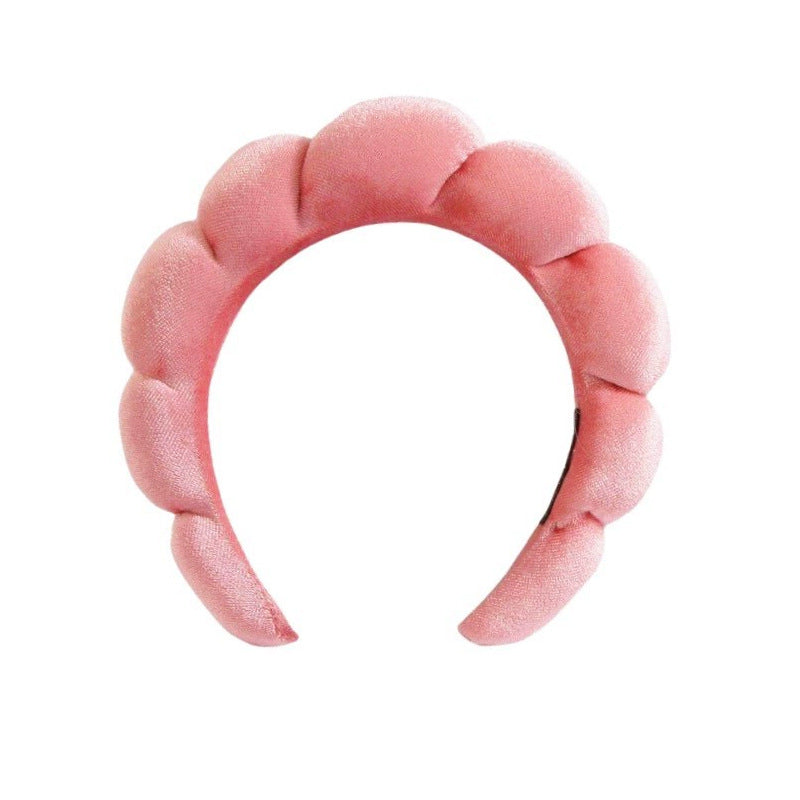 A towel fleece sponge twist headband