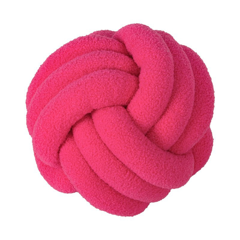 A braided knotted ball pillow