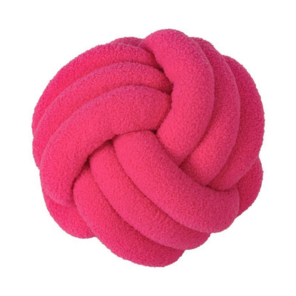 A braided knotted ball pillow