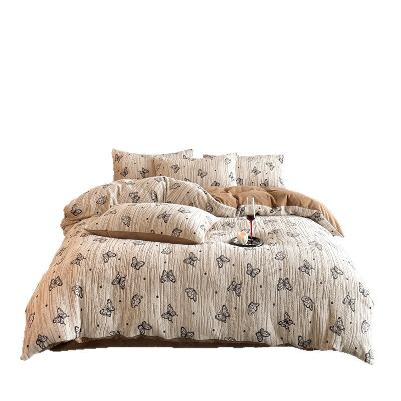 A four-piece quilt cover on the bed