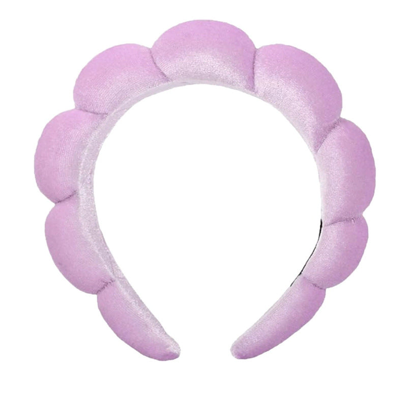 A towel fleece sponge twist headband