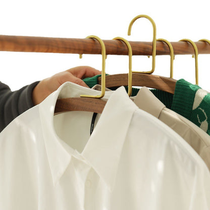 A semi-circular black walnut solid wood hanger