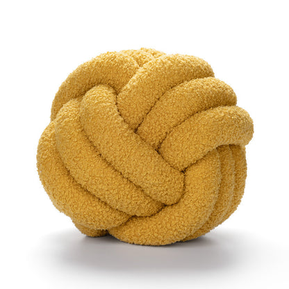 A braided knotted ball pillow