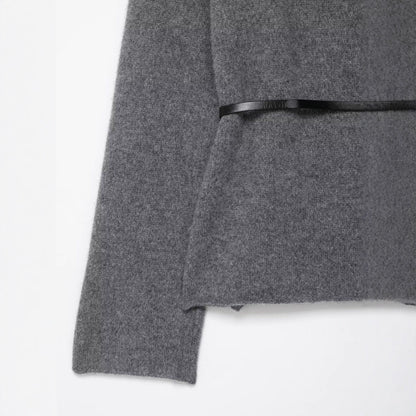 A knitted cardigan sweater jacket