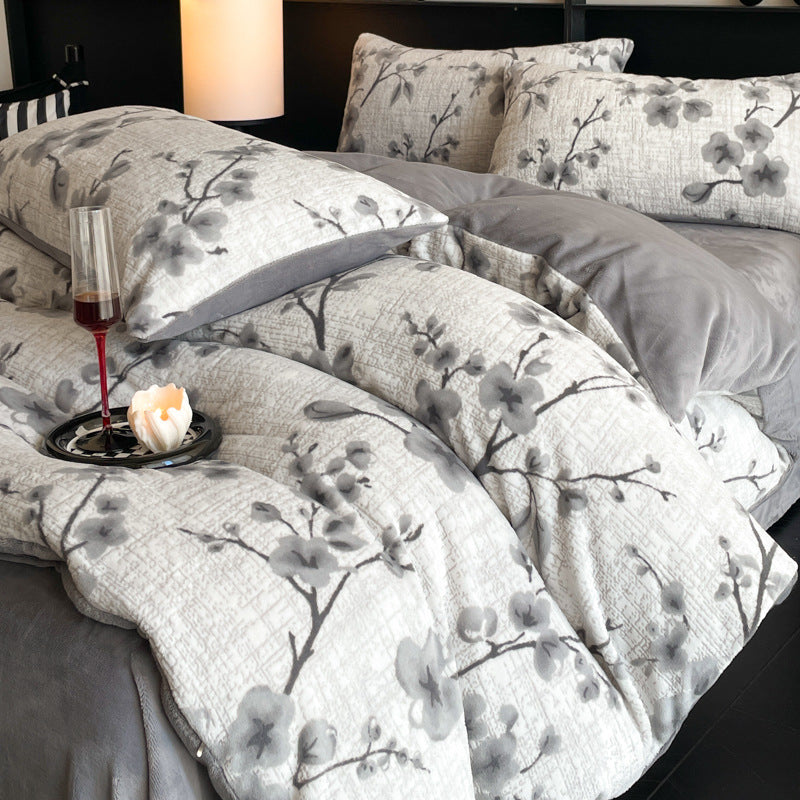 A four-piece quilt cover on the bed