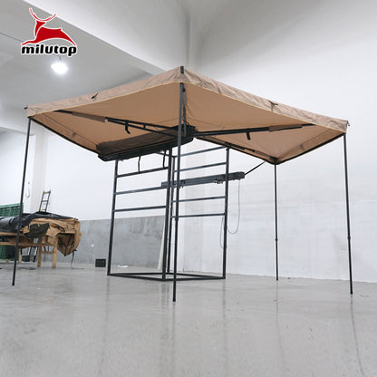 A double pole scalloped roof tent with lights