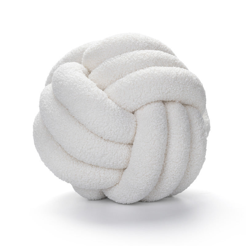 A braided knotted ball pillow