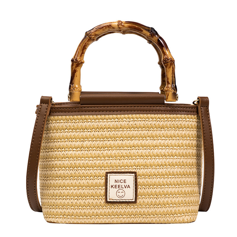 A summer new textured bamboo handle woven bag Thailand travel vacation fashion messenger straw bag