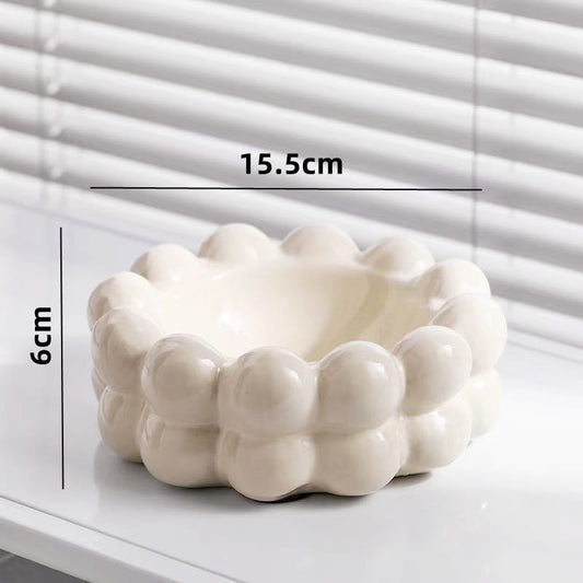 A ceramic tissue box ashtray