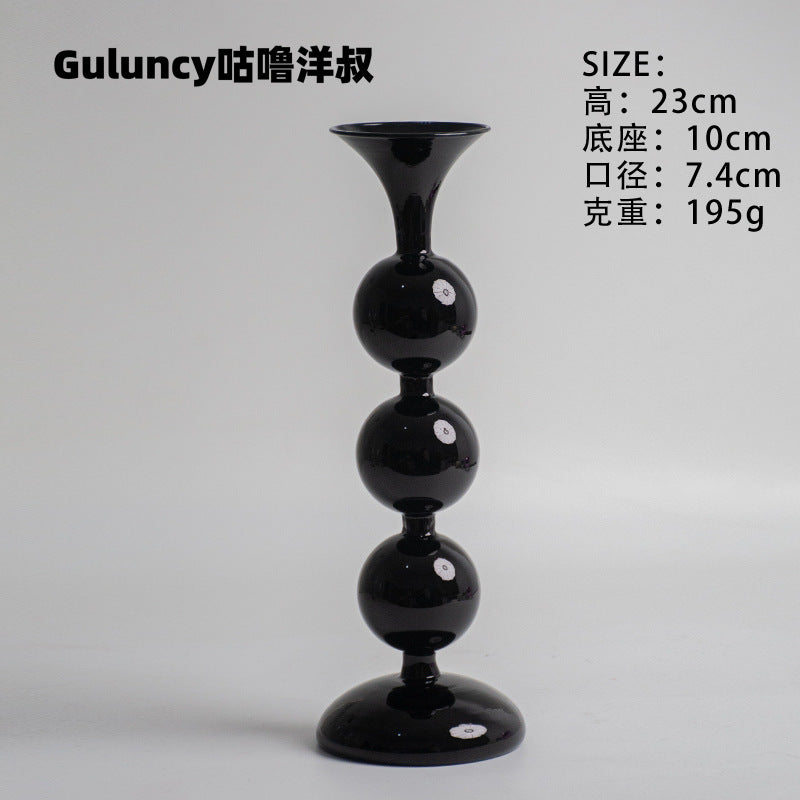 A vintage French Roman column glass candle holder