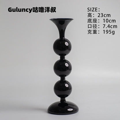 A vintage French Roman column glass candle holder